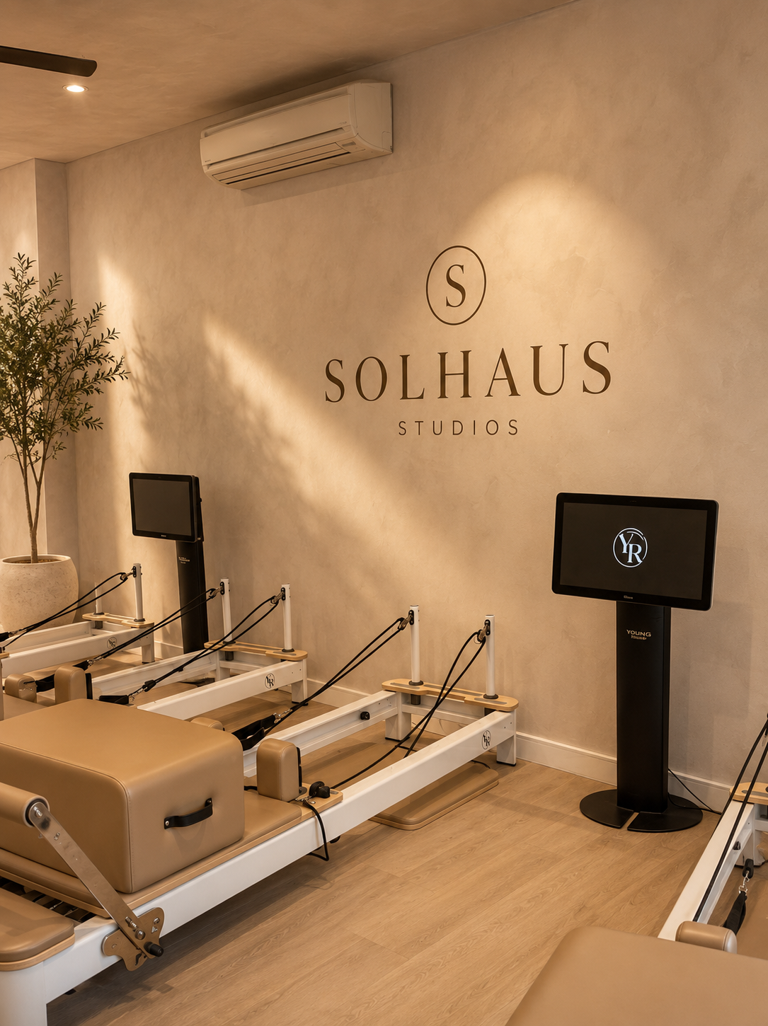 The Solhaus Studios logo wall in soft afternoon light