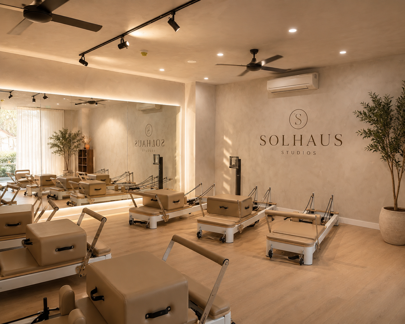Rows of reformers beneath the Solhaus Studios wall signage